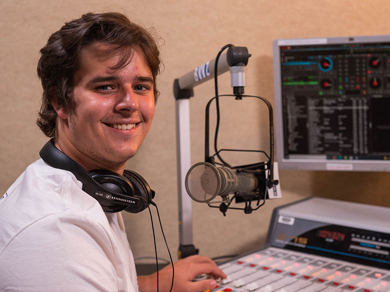 A student working in the BVZ Radio station on campus